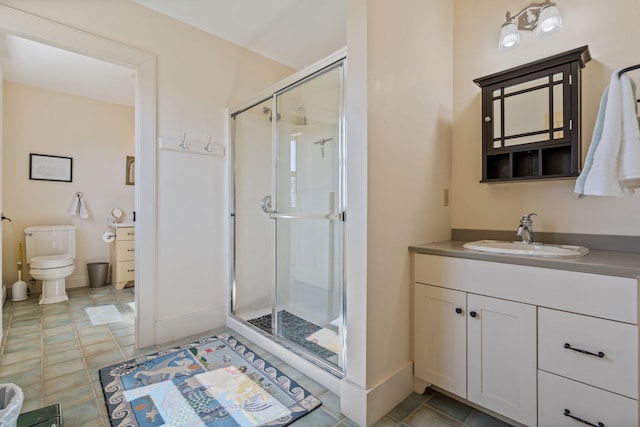 18 Pleasant St, Newcastle, ME 04553 - full bathroom featuring a shower stall, vanity, toilet, baseboards, and tile patterned flooring