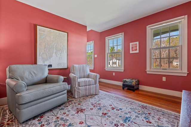 18 Pleasant St, Newcastle, ME 04553 - living area with wood finished floors, healthy amount of natural light, and baseboards