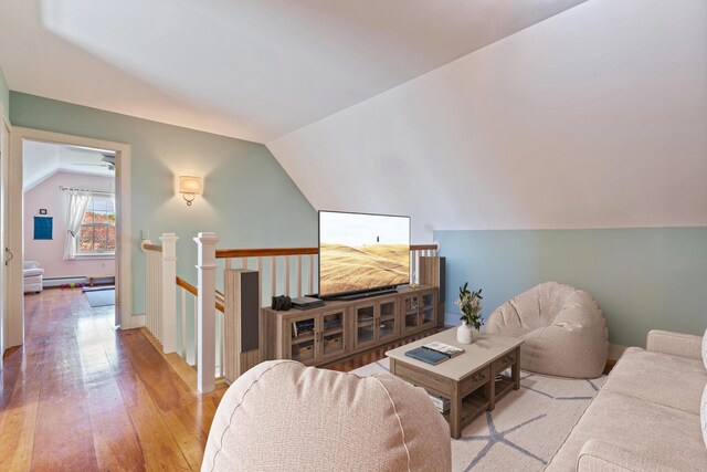 18 Pleasant St, Newcastle, ME 04553 - living room with lofted ceiling, light wood-style floors, and baseboard heating