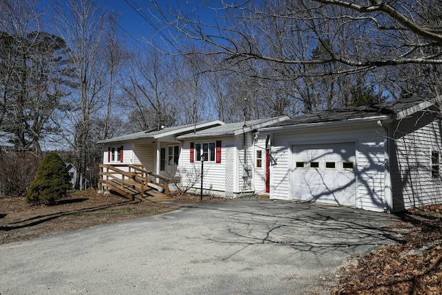 24 Lincoln St, Ellsworth, ME 04605 - ranch-style house with aphalt driveway and a garage
