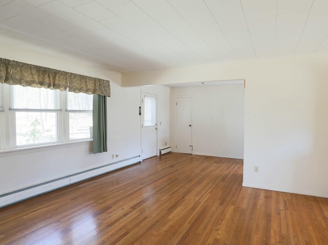24 Lincoln St, Ellsworth, ME 04605 - unfurnished room featuring a baseboard radiator and wood finished floors
