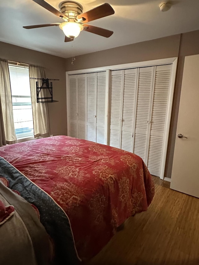 bedroom featuring wood finished floors and a ceiling fan
