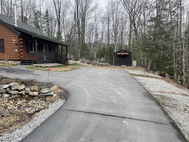 view of street featuring aphalt driveway