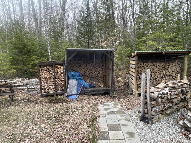 view of shed featuring a wooded view