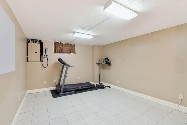50 Finn Parker Rd, Gorham, ME 04038 - exercise room with electric panel, a textured ceiling, baseboards, and light tile patterned floors