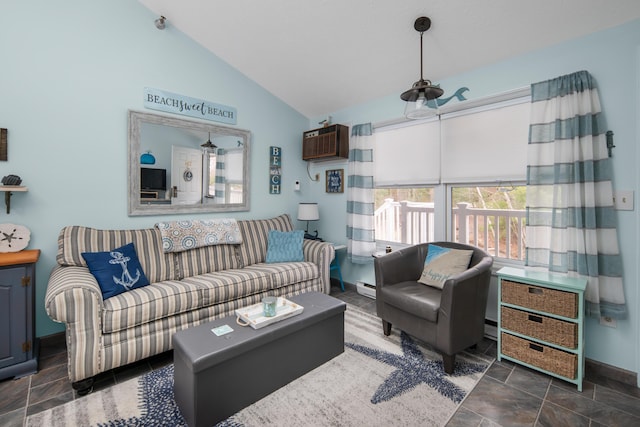 living room featuring a baseboard heating unit, lofted ceiling, stone tile floors, and a wall mounted air conditioner