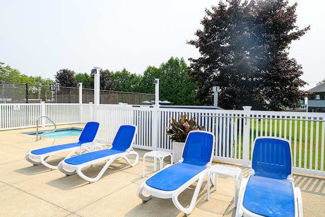 view of patio / terrace featuring fence