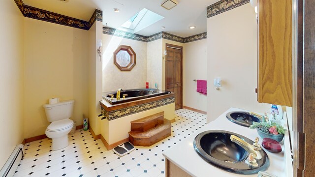 195 Rim Rd, East Machias, ME 04630 - bathroom featuring baseboard heating, a skylight, tile patterned floors, and toilet