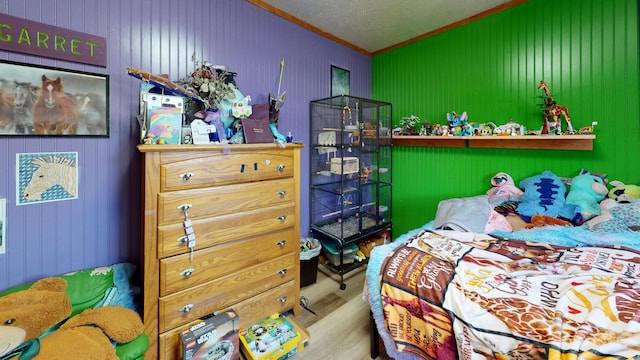 195 Rim Rd, East Machias, ME 04630 - bedroom featuring crown molding, wood finished floors, wooden walls, and lofted ceiling