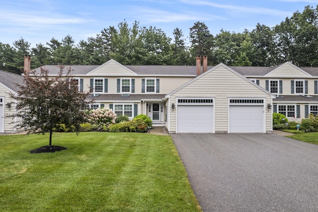 48 Windward Pointe Dr Unit 48, Wells, ME 04090 - view of front of property with a front yard, roof with shingles, an attached garage, and aphalt driveway