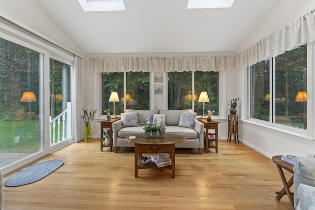 48 Windward Pointe Dr Unit 48, Wells, ME 04090 - sunroom with wood finished floors, a deck, and vaulted ceiling with skylight