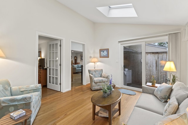 48 Windward Pointe Dr Unit 48, Wells, ME 04090 - living area featuring lofted ceiling with skylight and light wood-type flooring