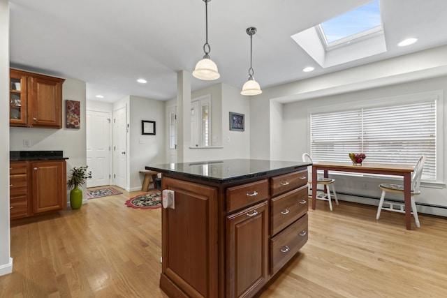 48 Windward Pointe Dr Unit 48, Wells, ME 04090 - kitchen featuring decorative light fixtures, light wood finished floors, a skylight, and a baseboard radiator