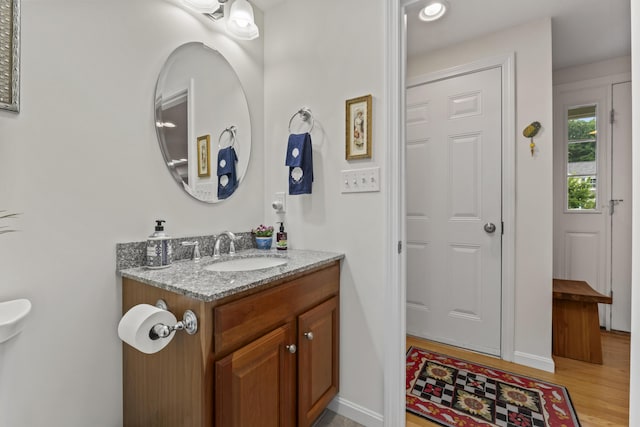 48 Windward Pointe Dr Unit 48, Wells, ME 04090 - bathroom featuring baseboards, vanity, and wood finished floors