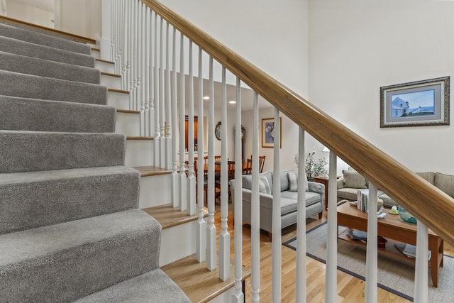 48 Windward Pointe Dr Unit 48, Wells, ME 04090 - staircase featuring a towering ceiling and wood finished floors