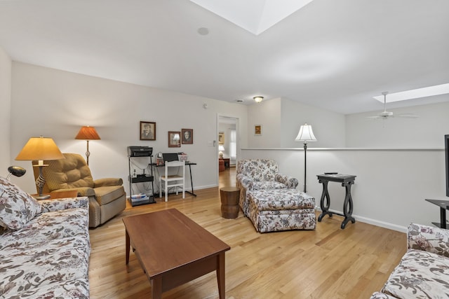 48 Windward Pointe Dr Unit 48, Wells, ME 04090 - living room with light wood finished floors, a skylight, baseboards, and ceiling fan