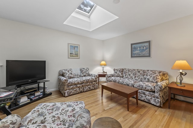 48 Windward Pointe Dr Unit 48, Wells, ME 04090 - living area featuring wood finished floors, a skylight, and a baseboard heating unit