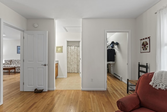 48 Windward Pointe Dr Unit 48, Wells, ME 04090 - interior space with light wood finished floors, attic access, baseboards, and baseboard heating