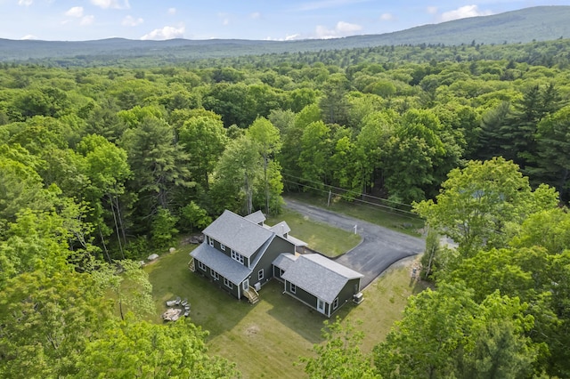 52 Birch Ests, Rome, ME 04963 - aerial view of property and surrounding area with a heavily wooded area and mountains