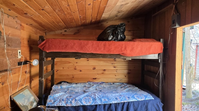 574 Half Township Rd, Lincoln, ME 04457 - bedroom featuring vaulted ceiling, wood walls, and wood ceiling
