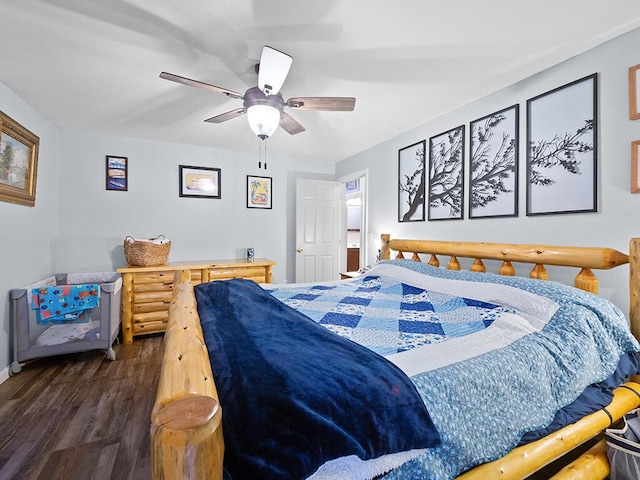 bedroom featuring baseboards, a ceiling fan, and dark wood finished floors