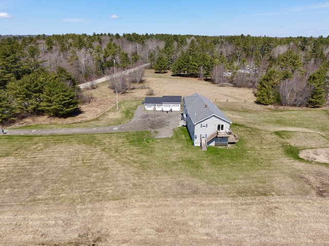 drone / aerial view featuring a view of trees