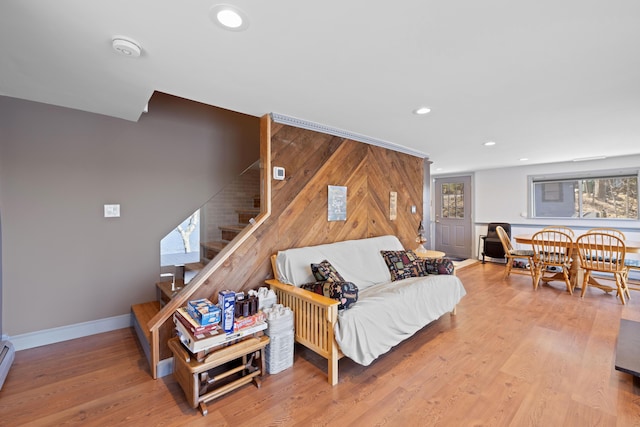 living area featuring recessed lighting, baseboards, stairs, and wood finished floors