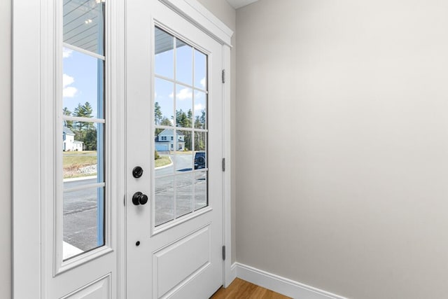 77 Creeks Edge Dr Unit 0, Saco, ME 04072 - doorway to outside with baseboards, light wood finished floors, and a wealth of natural light