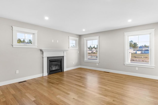 77 Creeks Edge Dr Unit 0, Saco, ME 04072 - unfurnished living room featuring plenty of natural light, light wood-type flooring, and visible vents