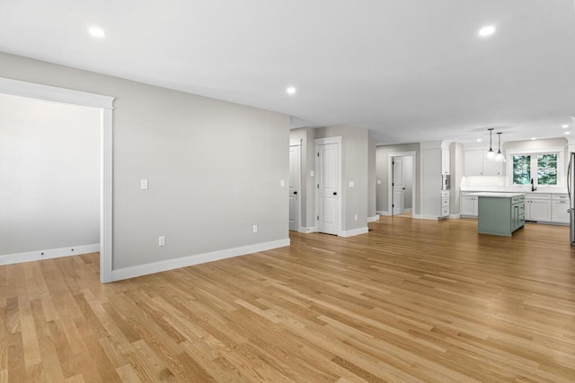 77 Creeks Edge Dr Unit 0, Saco, ME 04072 - unfurnished living room with recessed lighting, light wood-style flooring, and baseboards