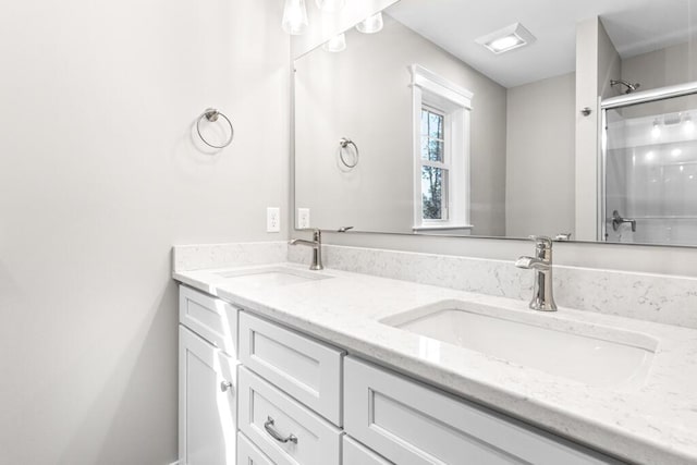77 Creeks Edge Dr Unit 0, Saco, ME 04072 - bathroom featuring a sink, an enclosed shower, and double vanity