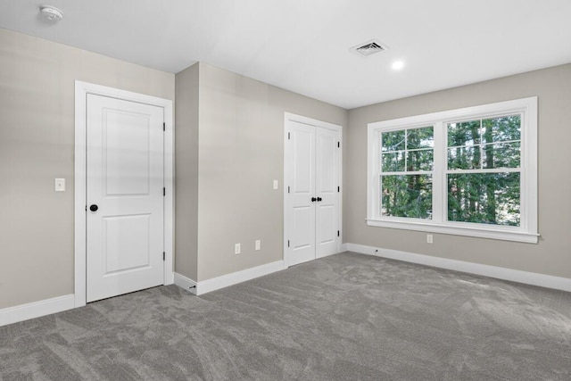 77 Creeks Edge Dr Unit 0, Saco, ME 04072 - unfurnished bedroom with carpet floors, baseboards, visible vents, and a closet