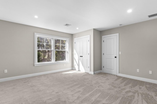 77 Creeks Edge Dr Unit 0, Saco, ME 04072 - unfurnished bedroom featuring baseboards, light carpet, recessed lighting, and visible vents