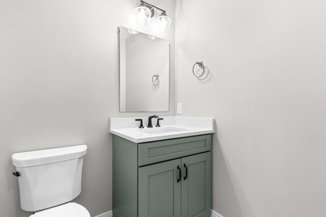 77 Creeks Edge Dr Unit 0, Saco, ME 04072 - half bathroom with toilet, baseboards, and vanity