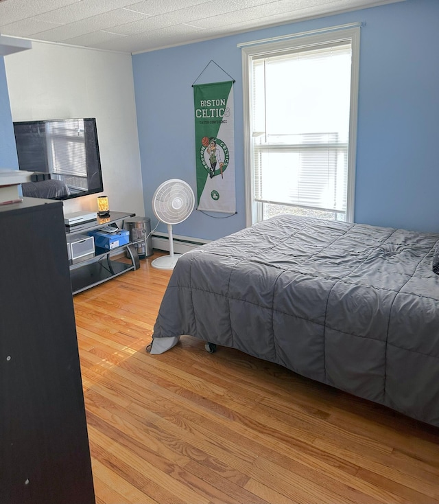 6 Ridge Rd, Corinth, ME 04427 - bedroom featuring baseboard heating and wood finished floors