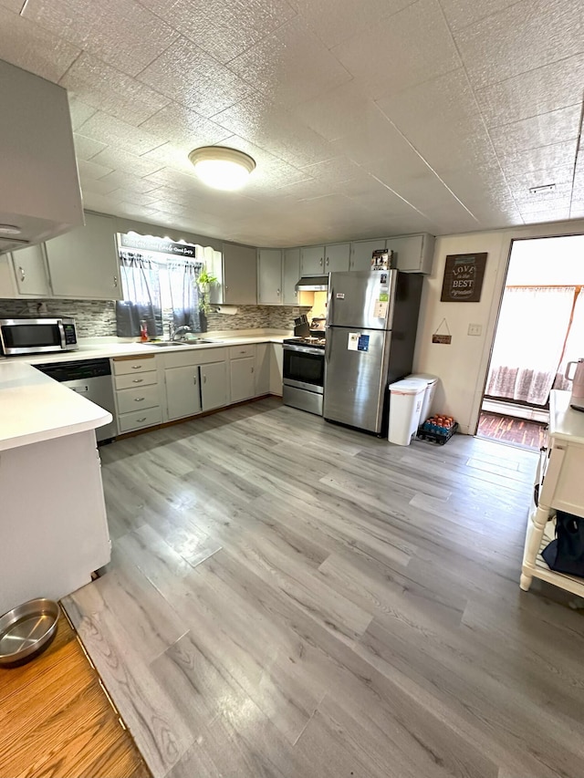 6 Ridge Rd, Corinth, ME 04427 - kitchen featuring appliances with stainless steel finishes, gray cabinetry, a sink, and plenty of natural light