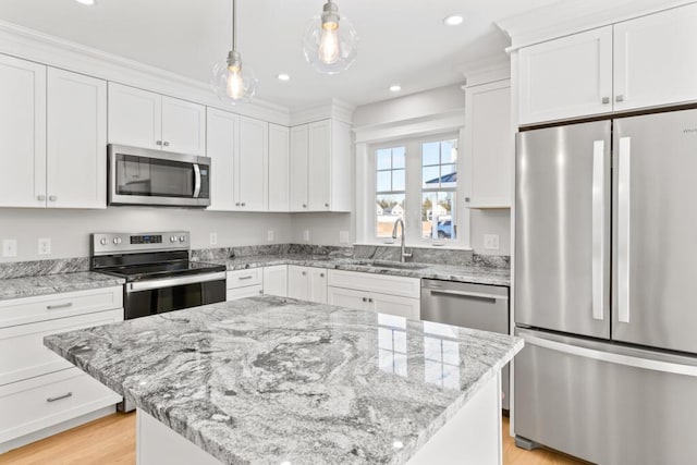 193 Stewart Dr Unit 0, Scarborough, ME 04074 - kitchen with appliances with stainless steel finishes, a sink, white cabinetry, recessed lighting, and pendant lighting
