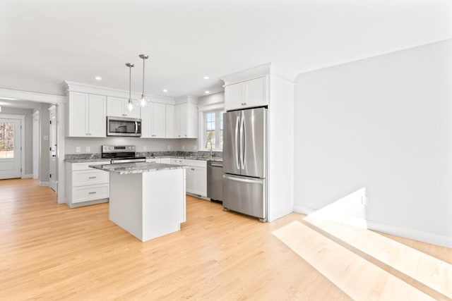 193 Stewart Dr Unit 0, Scarborough, ME 04074 - kitchen with a kitchen island, stainless steel appliances, and white cabinets