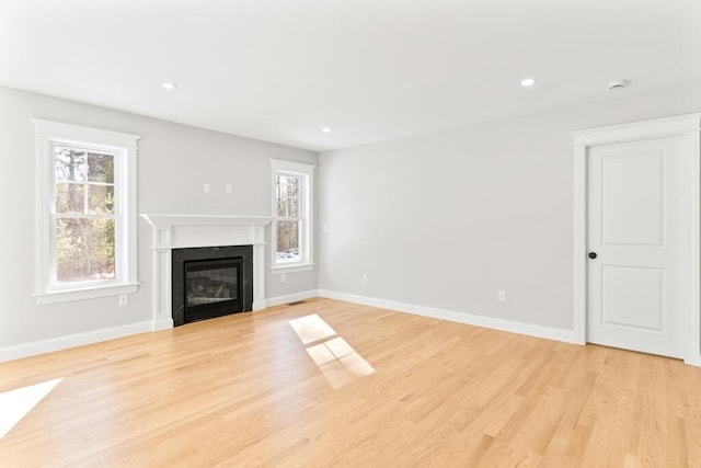 193 Stewart Dr Unit 0, Scarborough, ME 04074 - unfurnished living room with baseboards, recessed lighting, light wood finished floors, and a premium fireplace