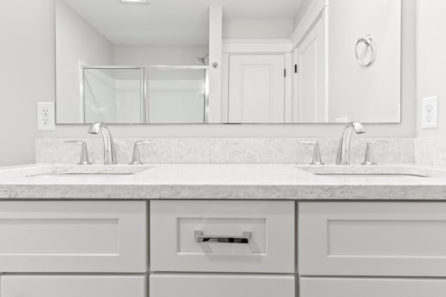 193 Stewart Dr Unit 0, Scarborough, ME 04074 - bathroom with a sink, a shower stall, and double vanity