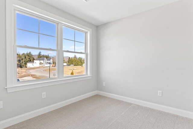 193 Stewart Dr Unit 0, Scarborough, ME 04074 - spare room featuring carpet floors, baseboards, and plenty of natural light