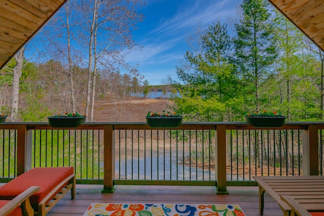 wooden deck featuring a water view