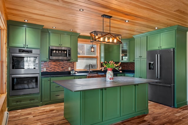 kitchen featuring wood ceiling, a sink, appliances with stainless steel finishes, green cabinets, and a kitchen island
