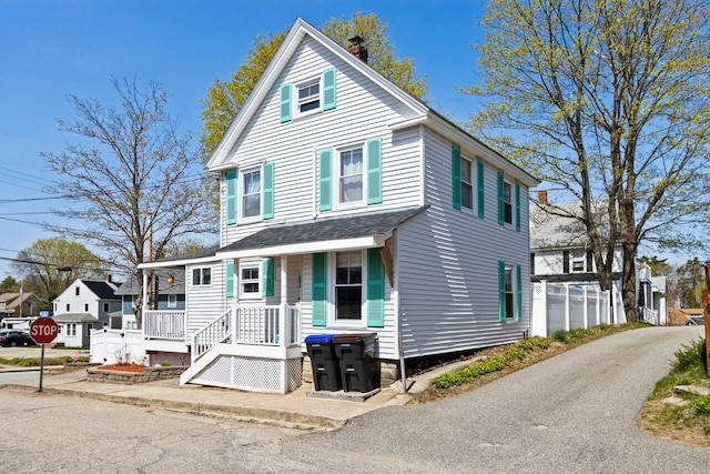 15 Longwood Ave, Old Orchard Beach, ME 04064 - american foursquare style home with covered porch, a residential view, and a chimney