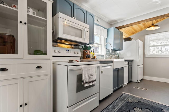 15 Longwood Ave, Old Orchard Beach, ME 04064 - kitchen featuring decorative backsplash, blue cabinets, baseboards, glass insert cabinets, and white appliances