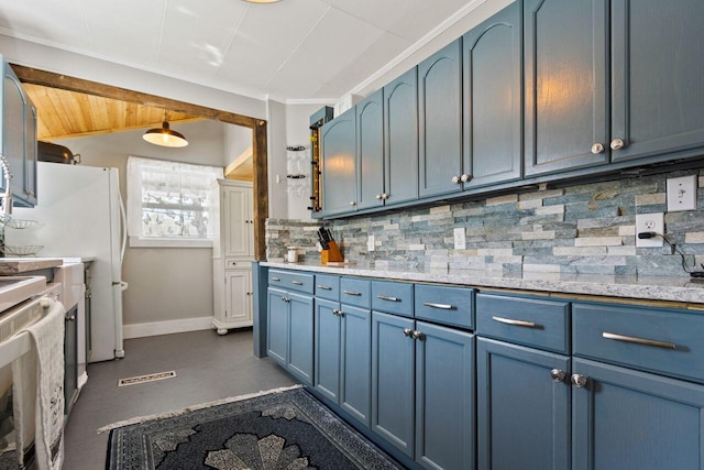 15 Longwood Ave, Old Orchard Beach, ME 04064 - kitchen with blue cabinetry, stove, baseboards, and tasteful backsplash