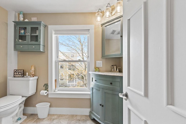 15 Longwood Ave, Old Orchard Beach, ME 04064 - half bathroom with baseboards, vanity, toilet, and visible vents