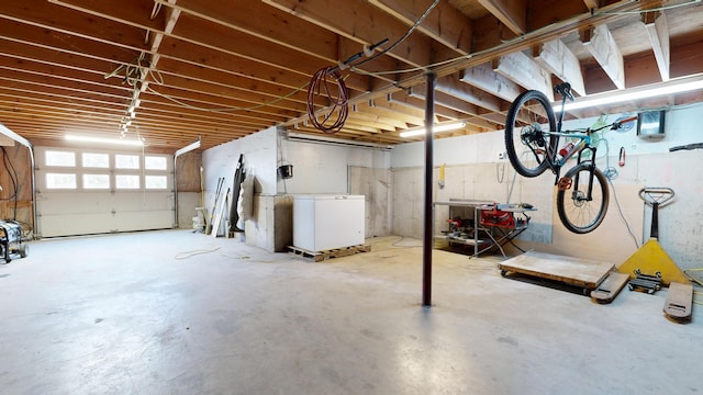 basement featuring fridge