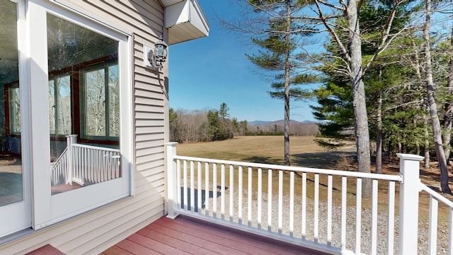 wooden deck featuring a mountain view