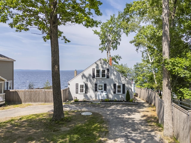 1485 Richville Rd, Standish, ME 04084 - view of front facade featuring a chimney, a water view, and curved driveway